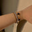 Black clover, tennis and twisted bracelet stack